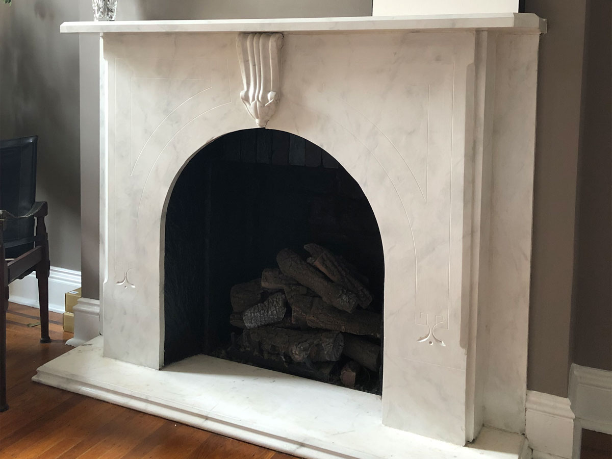 A painted faux marble fireplace